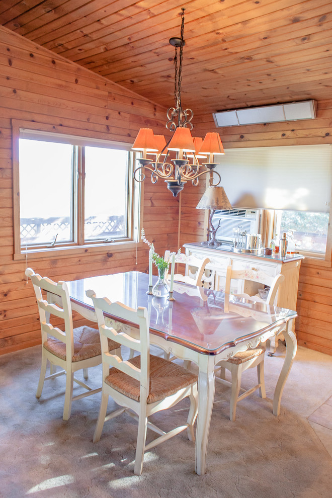 Dining room - rustic dining room idea in Denver