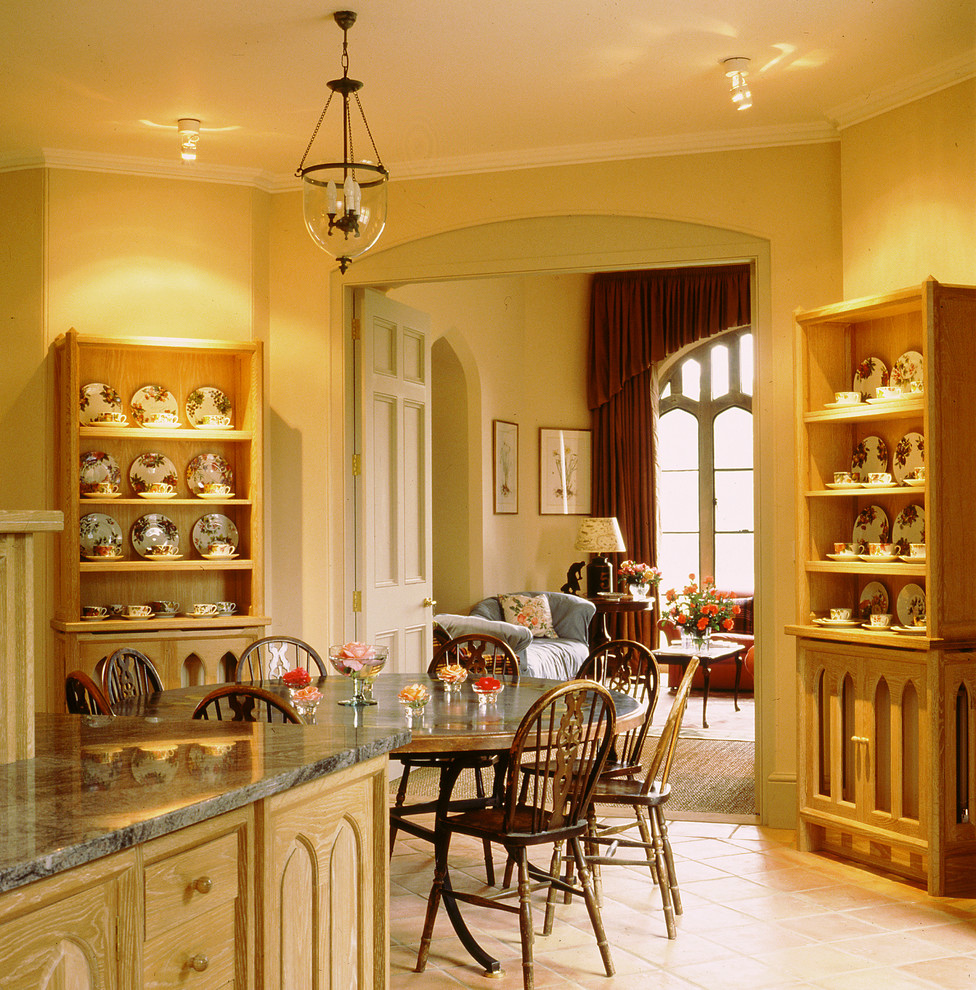 Design ideas for a traditional dining room in Other with terra-cotta floors.