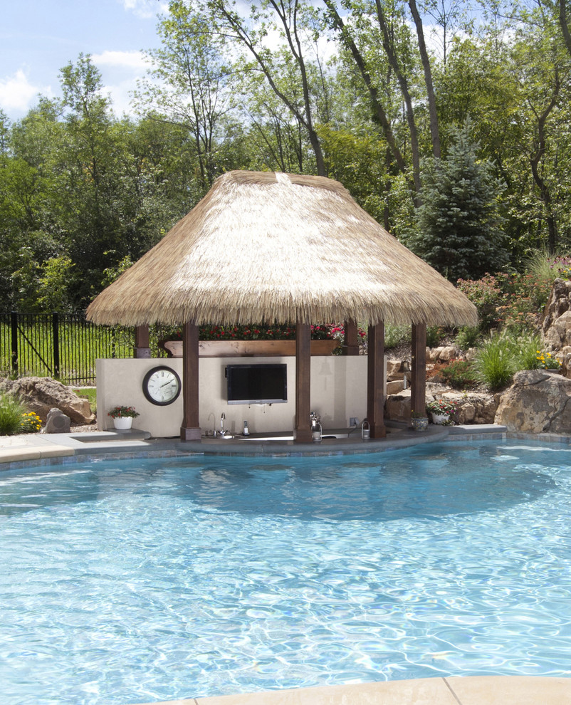 Photo of a large tropical backyard rectangular lap pool in Chicago.