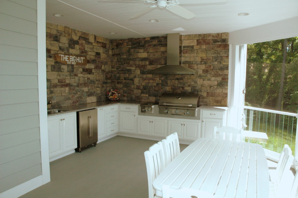 Outdoor kitchen deck - mid-sized transitional backyard outdoor kitchen deck idea in DC Metro with a roof extension