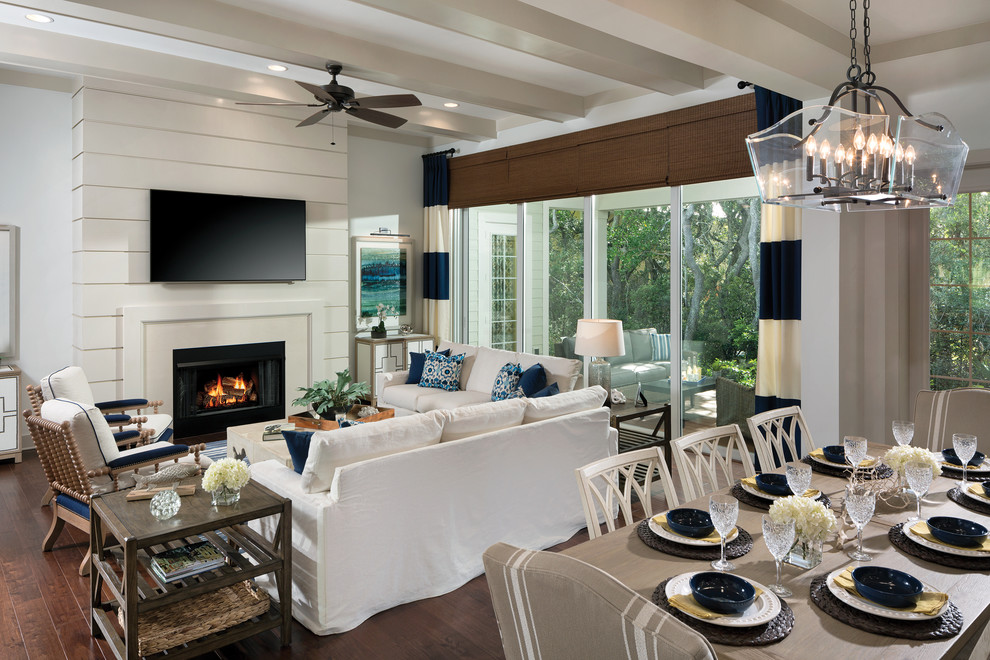 Design ideas for an expansive beach style dining room in Tampa with white walls and medium hardwood floors.