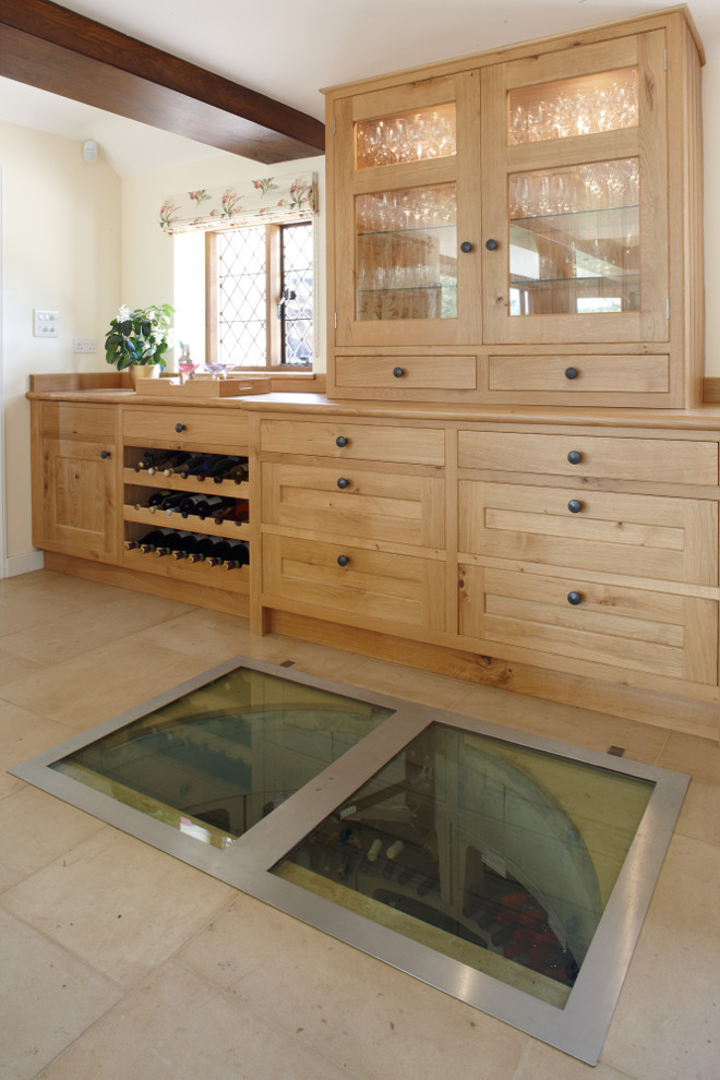 Inspiration for an expansive country wine cellar in Surrey.