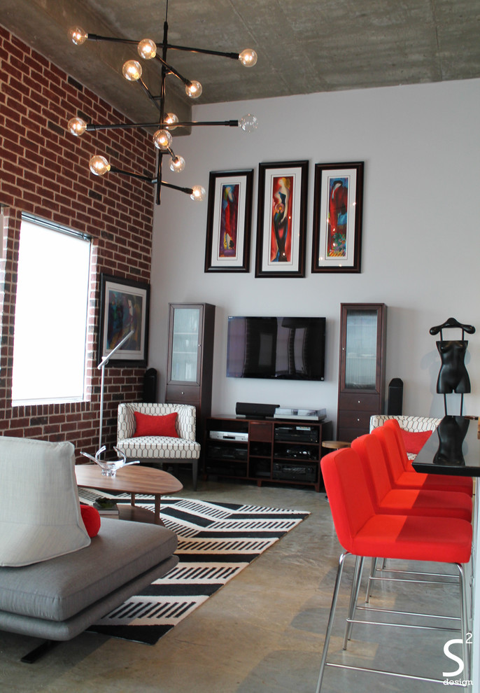 Large modern loft-style living room in Houston with white walls, concrete floors and a wall-mounted tv.