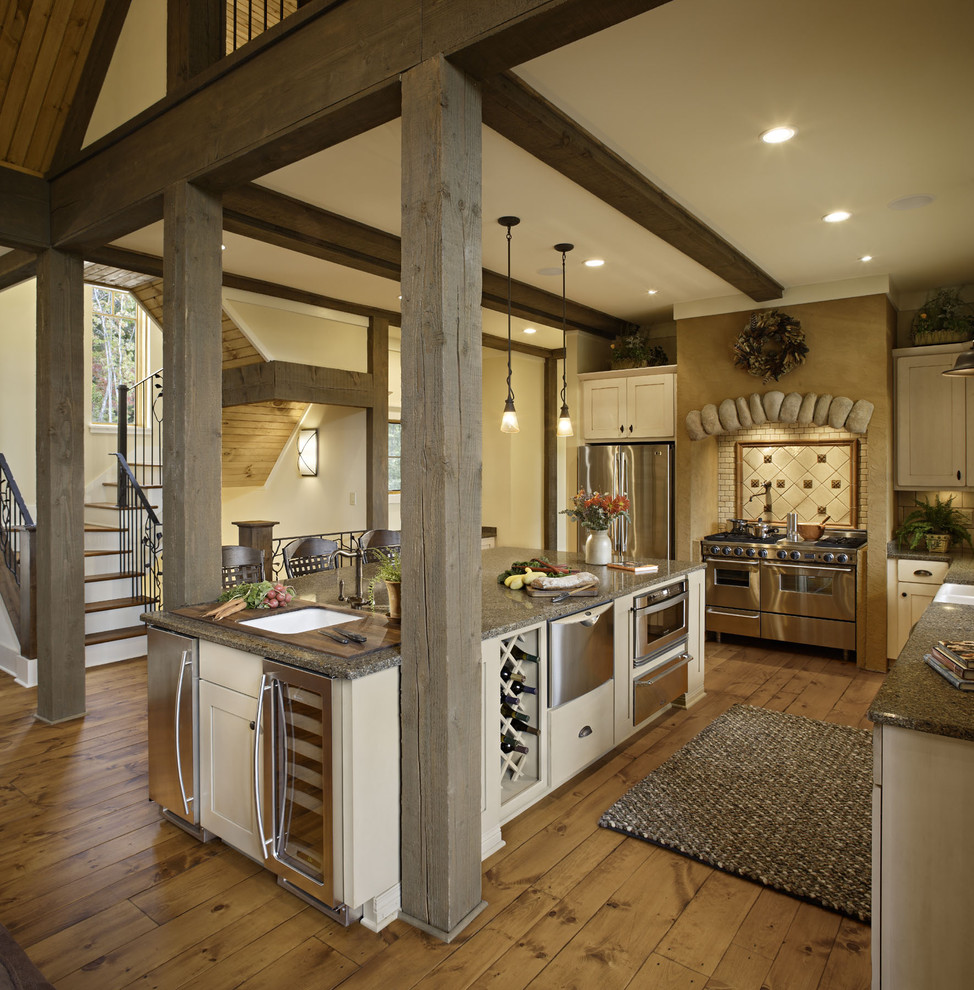 Inspiration for a country kitchen in Other with stainless steel appliances.