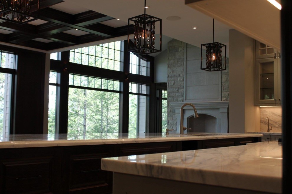 Example of a transitional kitchen design in Calgary