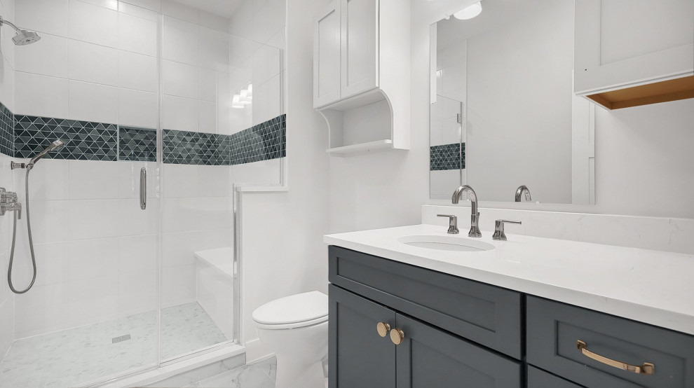 Transitional 3/4 alcove shower photo in Columbus with shaker cabinets, green cabinets, an undermount sink, quartz countertops, a hinged shower door, white countertops and a built-in vanity