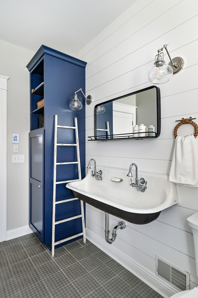 Inspiration for a mid-sized beach style 3/4 bathroom in Milwaukee with a curbless shower, a two-piece toilet, white walls, porcelain floors, a wall-mount sink, black floor, a hinged shower door, a niche, a double vanity, a floating vanity and planked wall panelling.