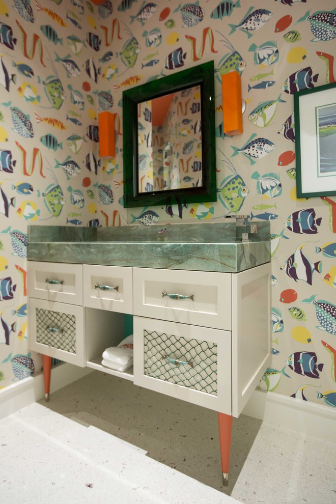 Photo of a beach style powder room in Miami with white cabinets, multi-coloured walls, shaker cabinets, a trough sink, terrazzo floors and green benchtops.