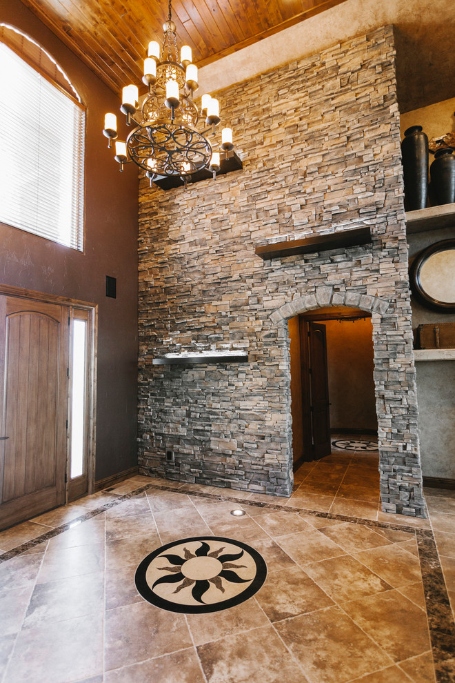 Inspiration for a mid-sized transitional slate floor front door remodel with brown walls and a medium wood front door