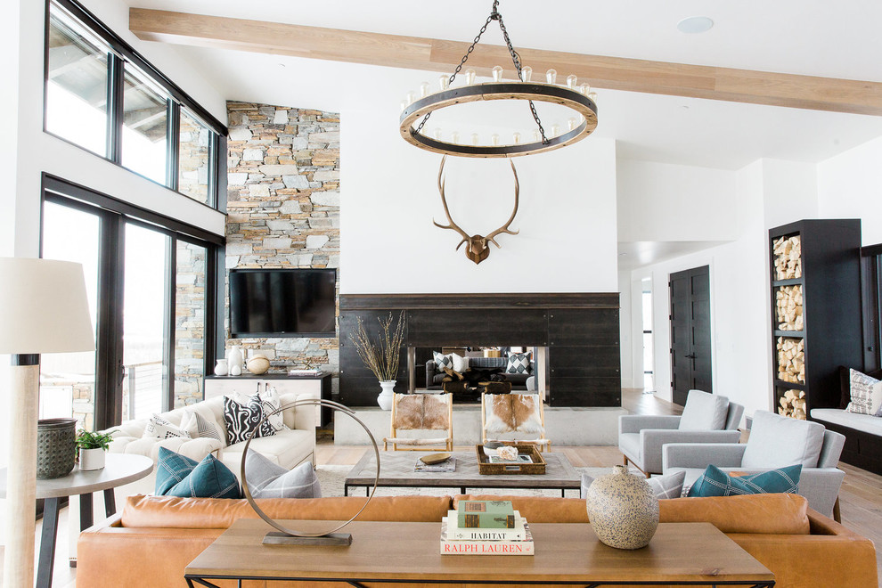 Inspiration for a transitional open concept living room in Salt Lake City with white walls, a two-sided fireplace and a wall-mounted tv.