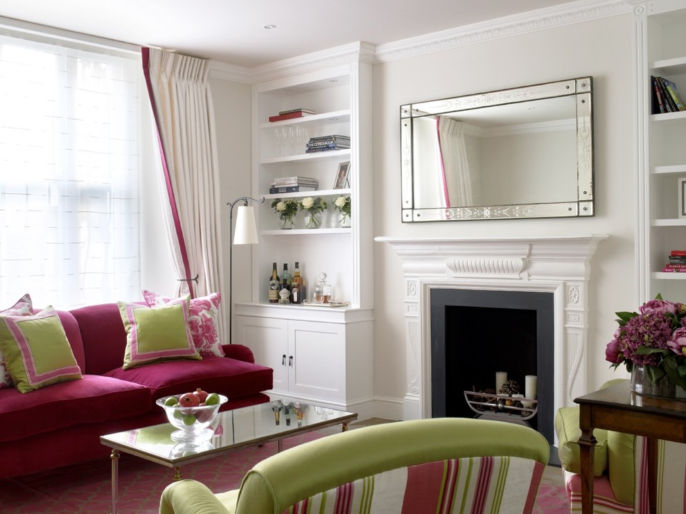 Photo of a traditional formal living room in London with a standard fireplace.