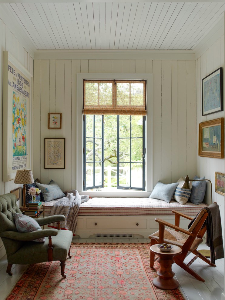 Inspiration for a small shabby-chic style painted wood floor and blue floor family room remodel in San Francisco with white walls and no tv