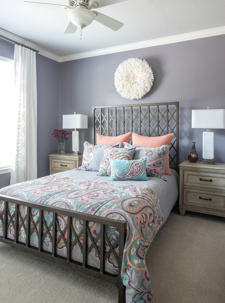 Small transitional guest bedroom in Dallas with purple walls, carpet and beige floor.