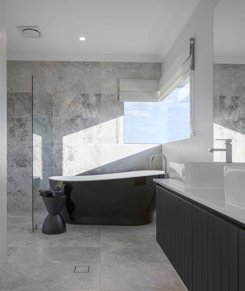 Inspiration for a mid-sized contemporary master bathroom in Sydney with an open shower, a double vanity and a freestanding tub.