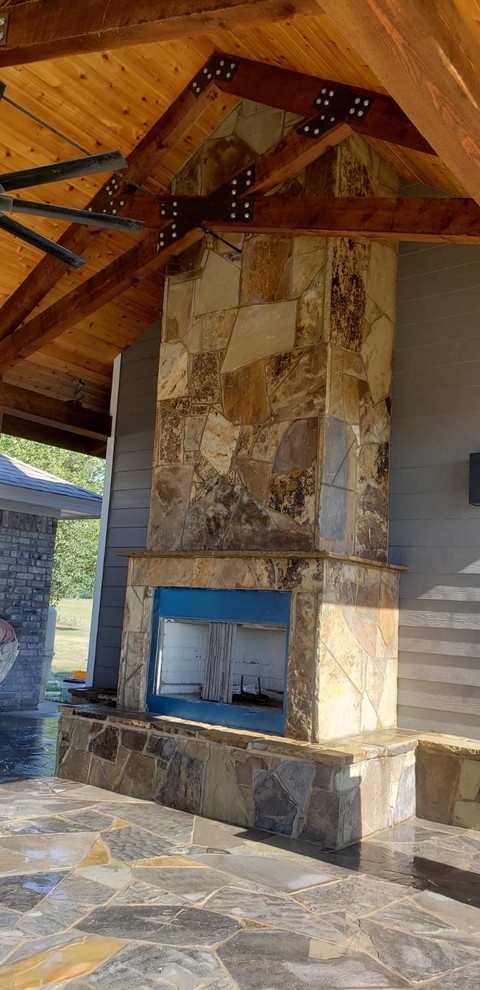 Example of a large classic patio design in Dallas with a gazebo