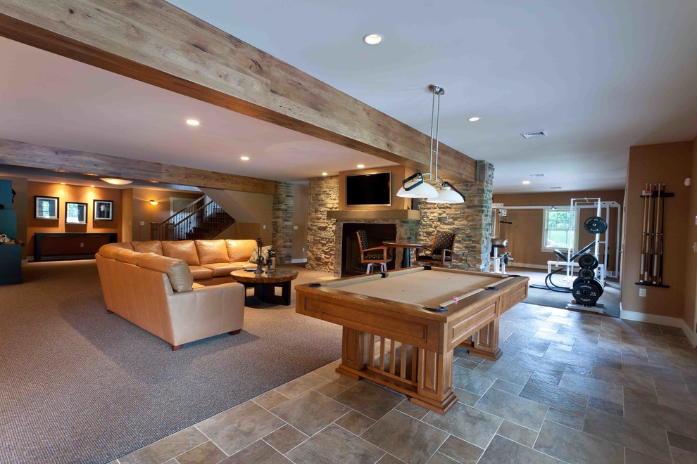 Design ideas for a mid-sized country fully buried basement in Other with brown walls, porcelain floors, a standard fireplace, a stone fireplace surround and multi-coloured floor.