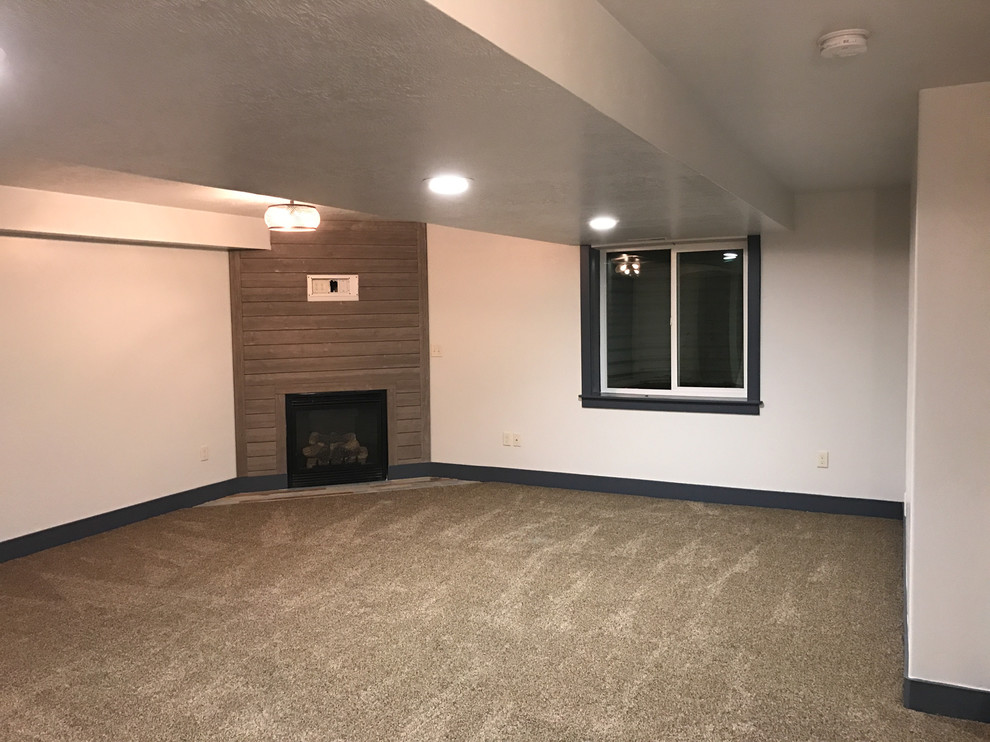 Photo of a mid-sized traditional formal enclosed living room in Salt Lake City with white walls, carpet, a corner fireplace, a wood fireplace surround and no tv.