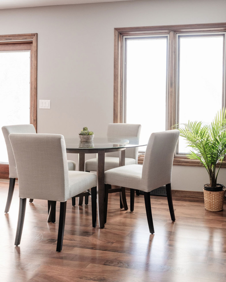 Example of a transitional dining room design in Omaha