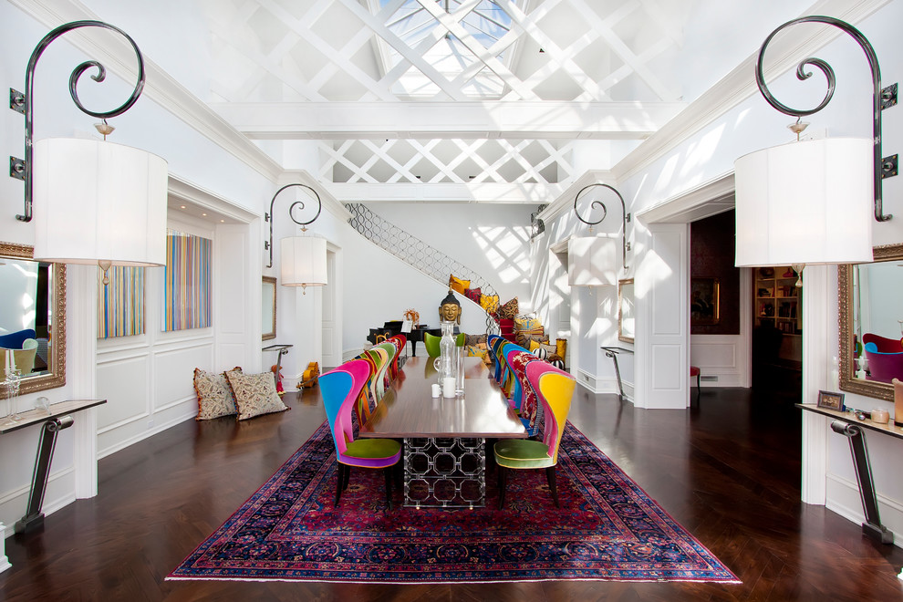 Photo of an eclectic separate dining room in Chicago with white walls and dark hardwood floors.
