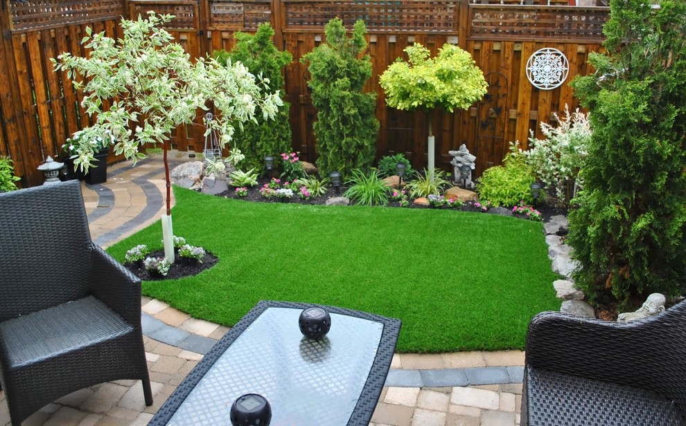 Design ideas for a small asian backyard garden in Other with brick pavers.
