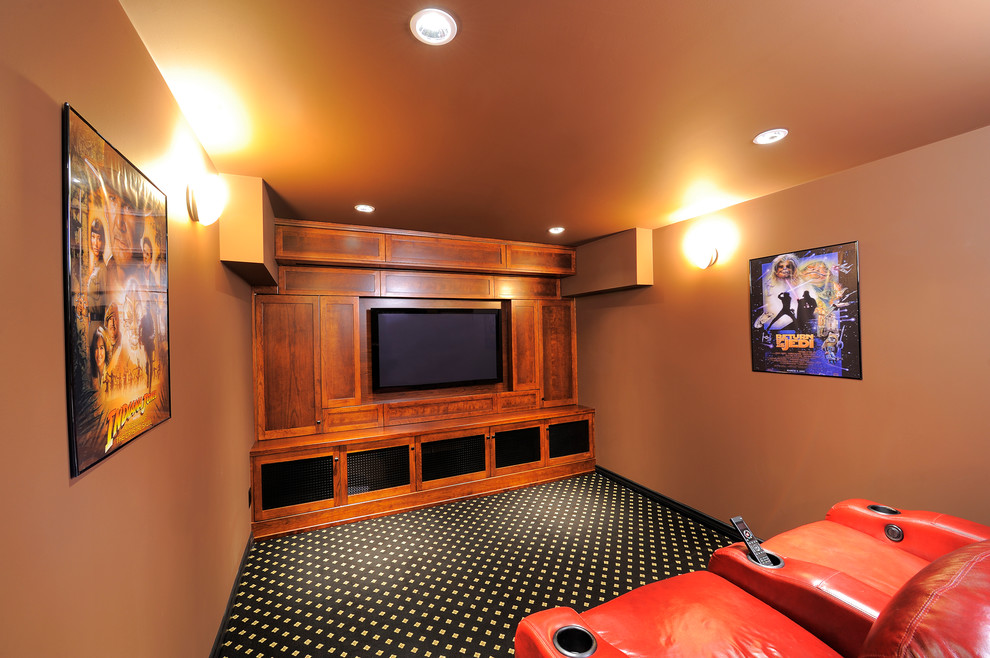 Photo of a mid-sized contemporary enclosed home theatre in Vancouver with brown walls, carpet, a built-in media wall and multi-coloured floor.