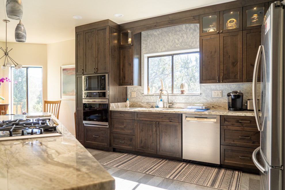 Inspiration for a transitional kitchen remodel with shaker cabinets, medium tone wood cabinets and an island