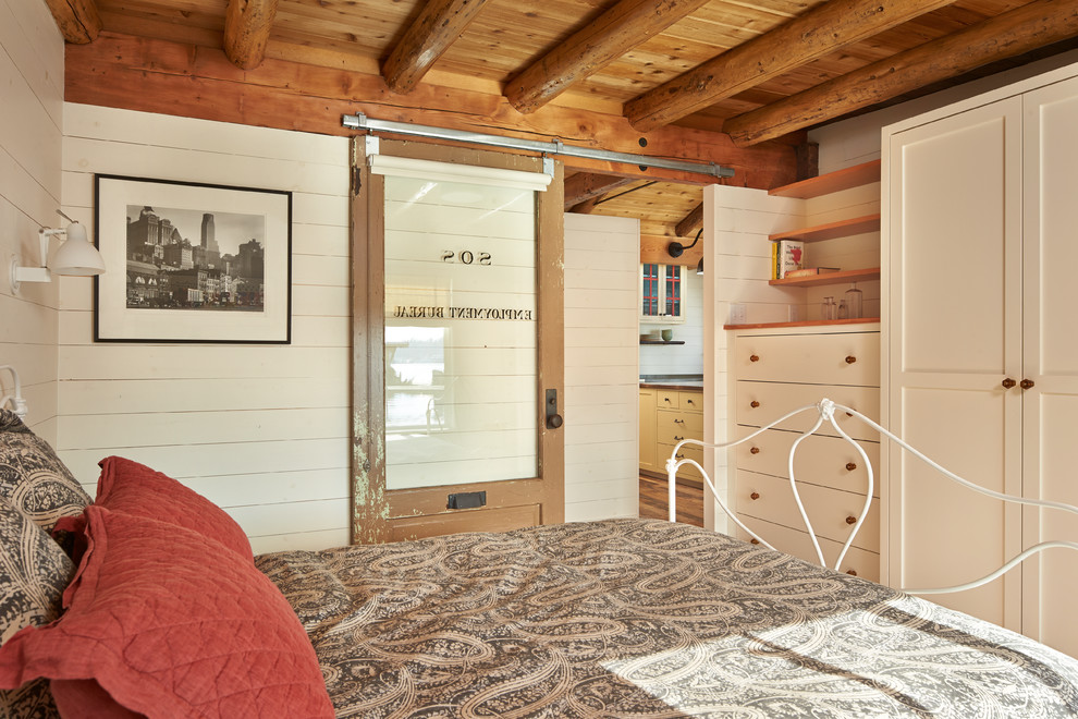 Mountain style bedroom photo in Seattle with beige walls