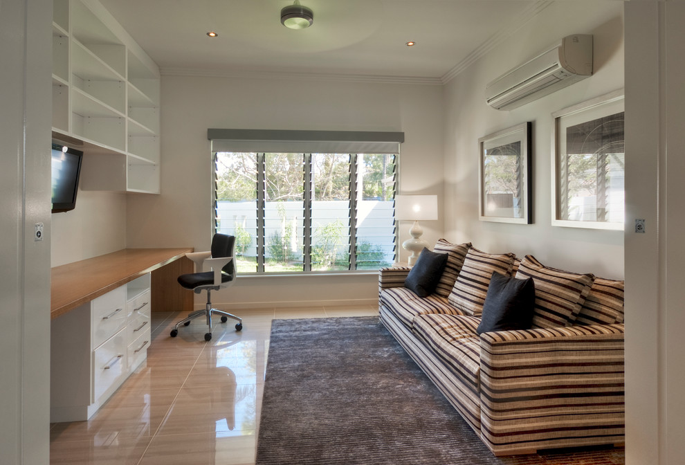 Design ideas for a beach style home office in Cairns.