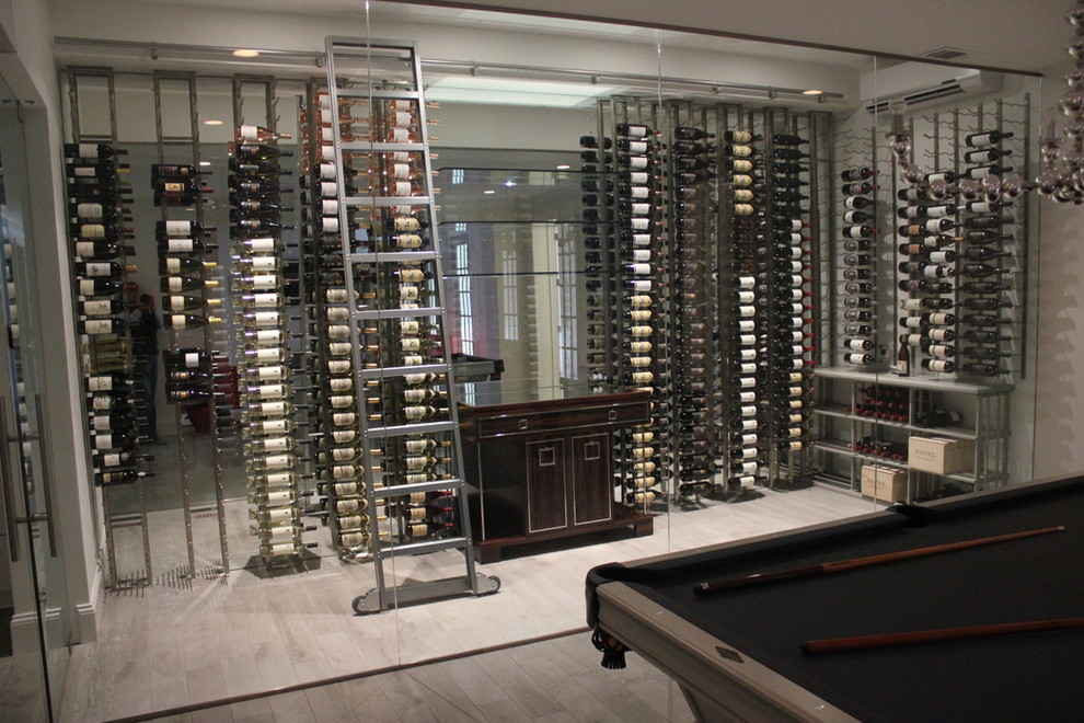 Design ideas for a large contemporary wine cellar in Atlanta with medium hardwood floors and display racks.