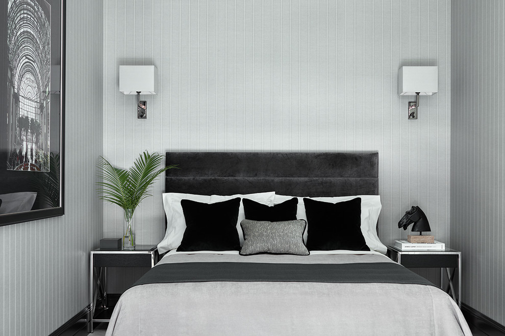 This is an example of a transitional guest bedroom in Moscow with grey walls and medium hardwood floors.