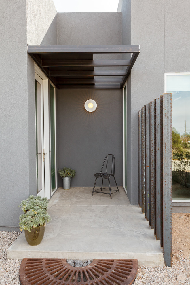 This is an example of an industrial front door in Albuquerque with a single front door and a glass front door.