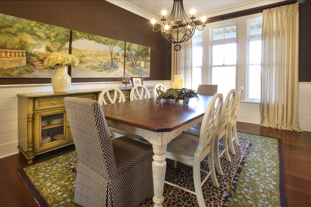 Design ideas for an eclectic dining room in Chicago with brown walls and dark hardwood floors.