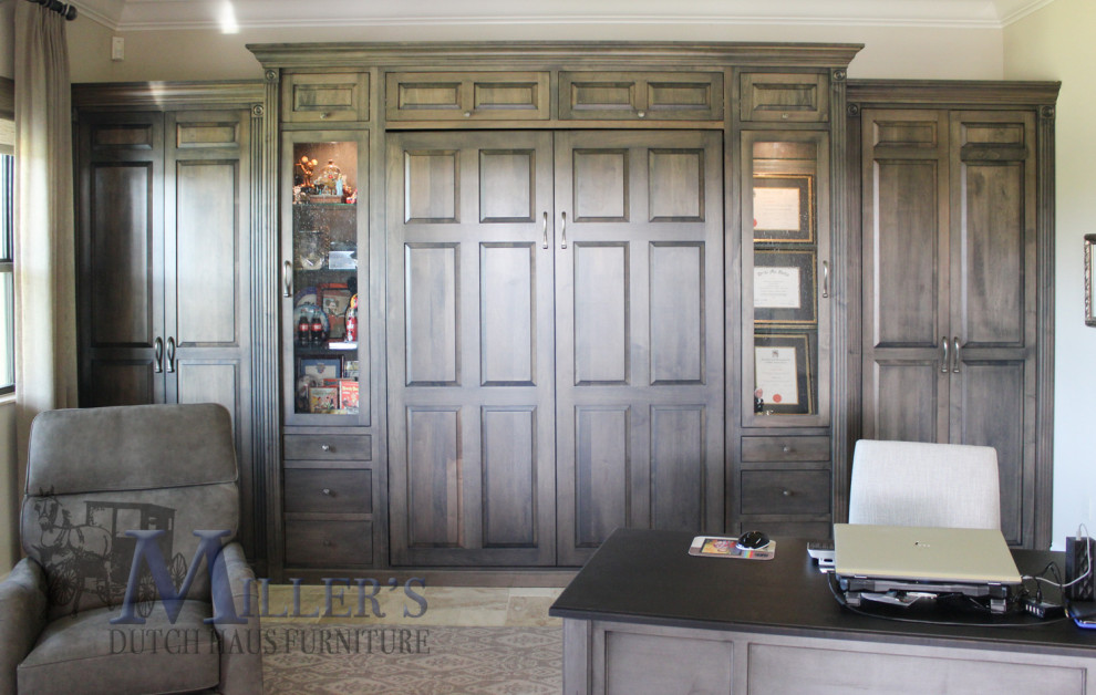 Large traditional home office in Tampa with beige walls, carpet and grey floors.