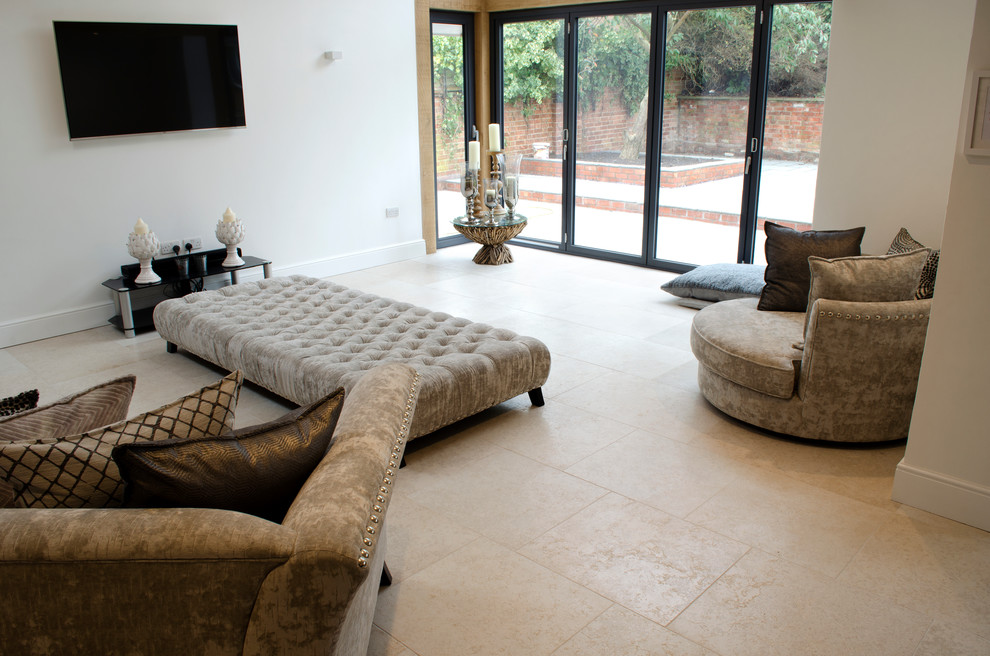 This is an example of a large transitional living room in Other with limestone floors.