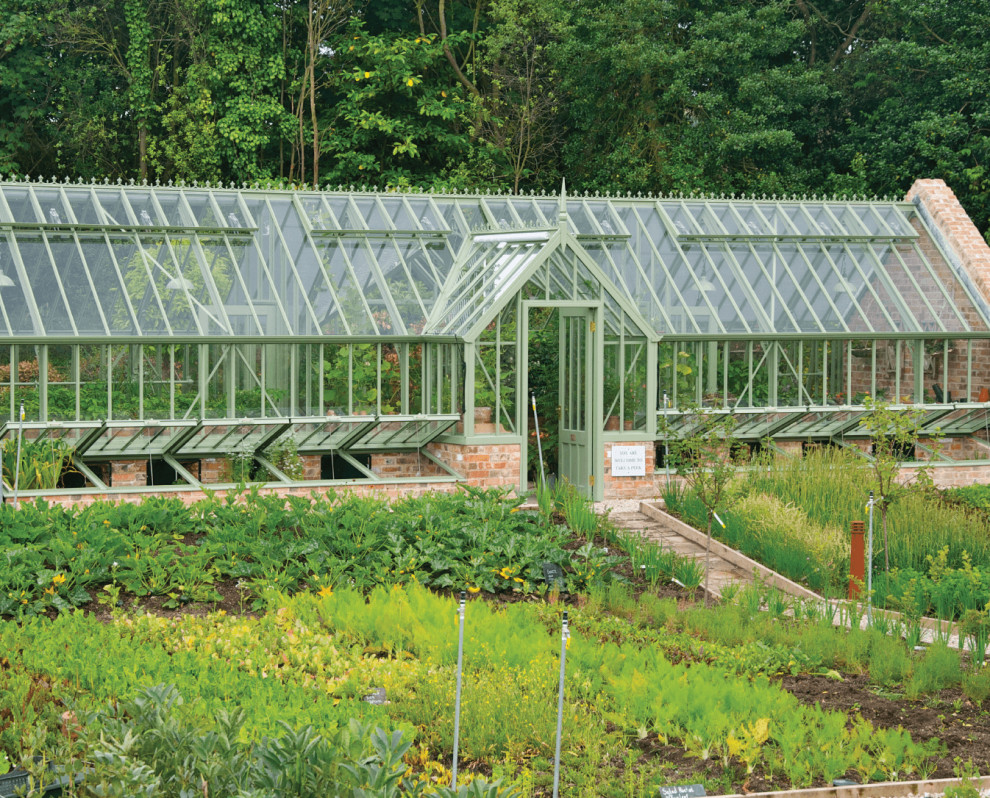 Large traditional attached greenhouse in Dorset.