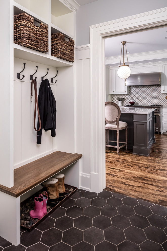 Photo of a traditional mudroom in Minneapolis with white walls.