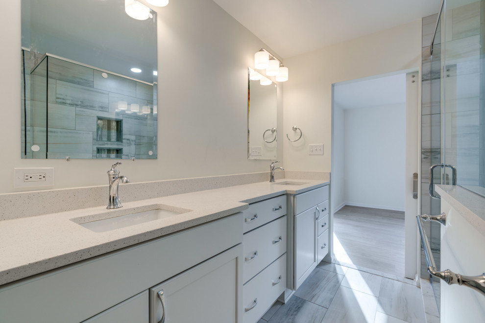 Large transitional master bathroom in DC Metro with flat-panel cabinets, white cabinets, a corner shower, a two-piece toilet, wood-look tile, an undermount sink, engineered quartz benchtops, a hinged shower door, a shower seat, a double vanity and a freestanding vanity.