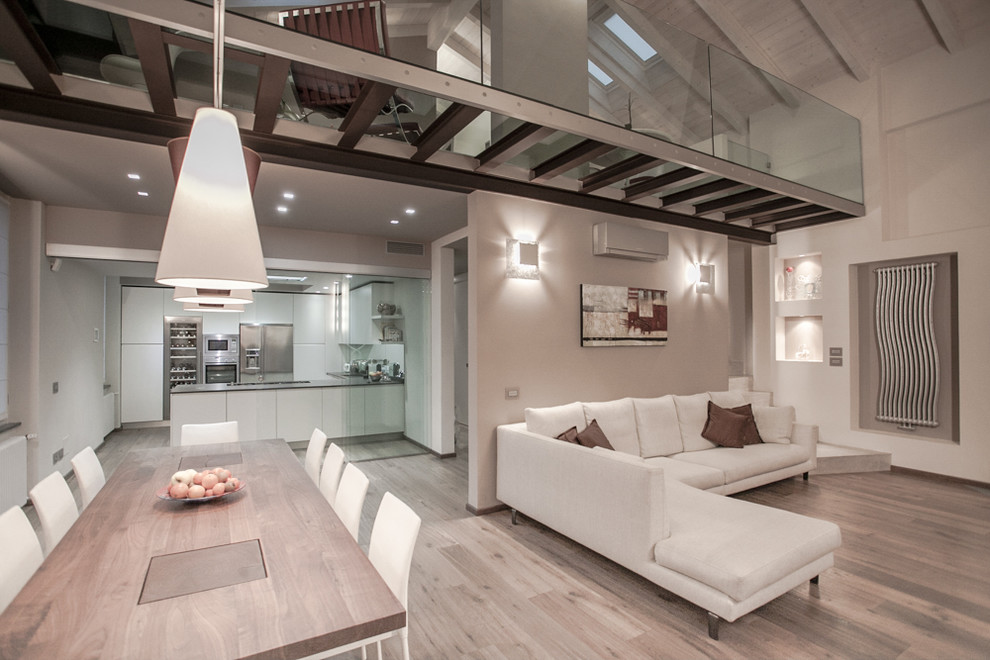 Large contemporary living room in Milan with beige walls, light hardwood floors and beige floor.
