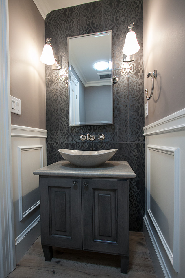 Inspiration for a large traditional master bathroom in San Francisco with raised-panel cabinets, brown cabinets, a drop-in tub, an alcove shower, a one-piece toilet, beige tile, porcelain tile, grey walls, marble floors, a vessel sink and engineered quartz benchtops.
