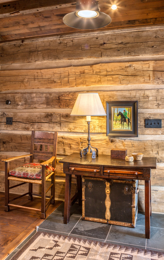 Example of a mountain style home design design in Denver