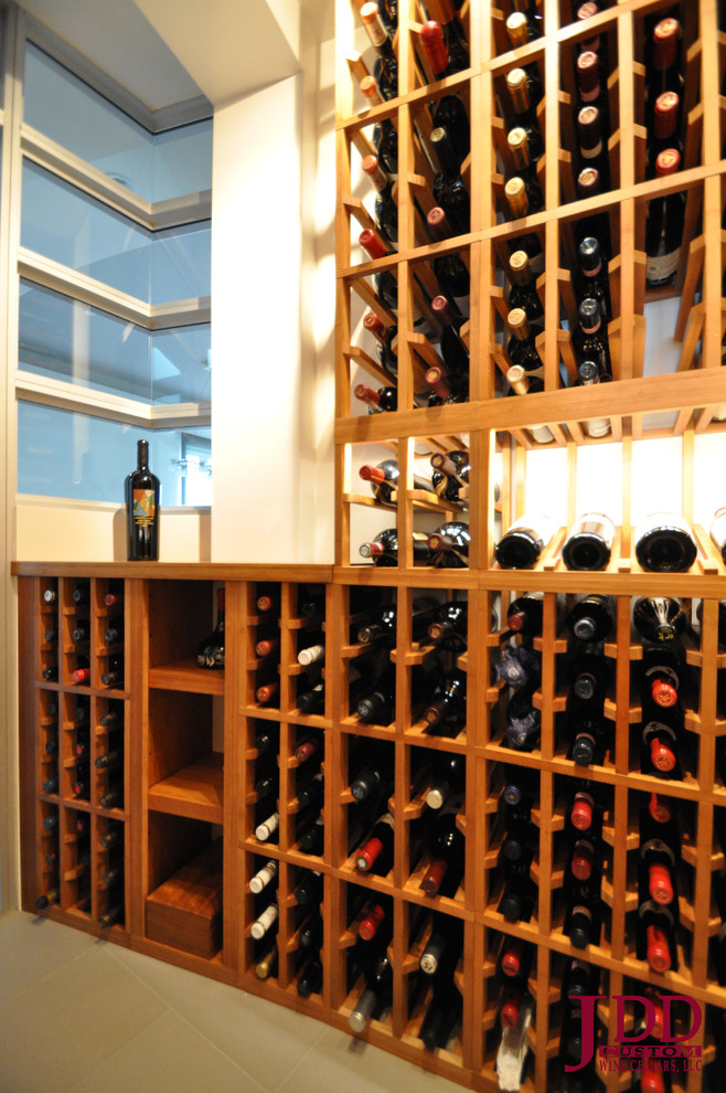 Photo of a mid-sized beach style wine cellar in San Diego.
