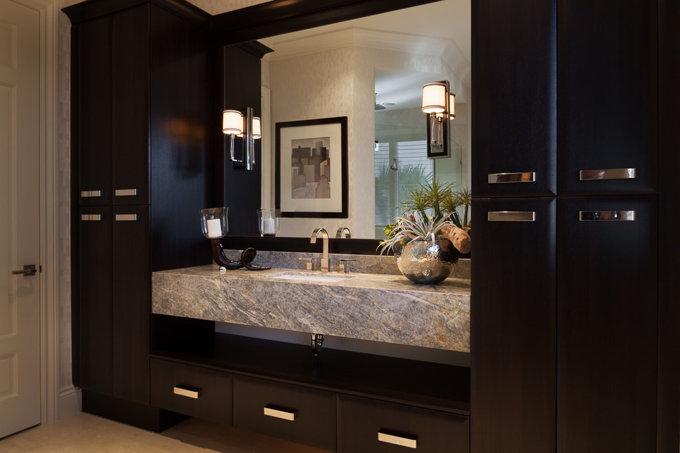 Freestanding bathtub - mid-sized transitional master beige tile, white tile and stone tile marble floor and beige floor freestanding bathtub idea in Miami with recessed-panel cabinets, white cabinets, white walls, an undermount sink, solid surface countertops and a hinged shower door