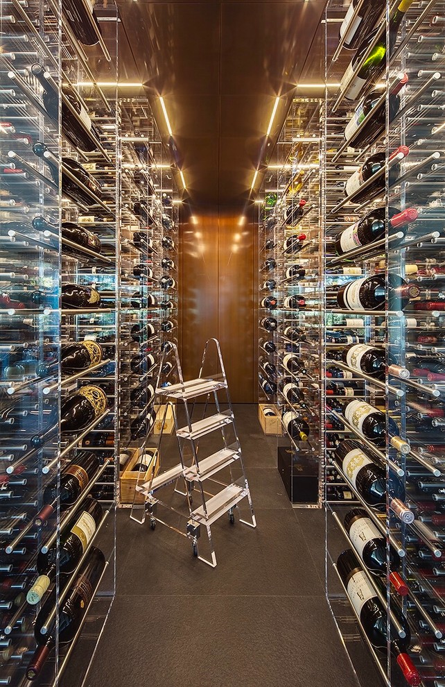 Inspiration for an expansive modern wine cellar in San Francisco with slate floors, storage racks and brown floor.