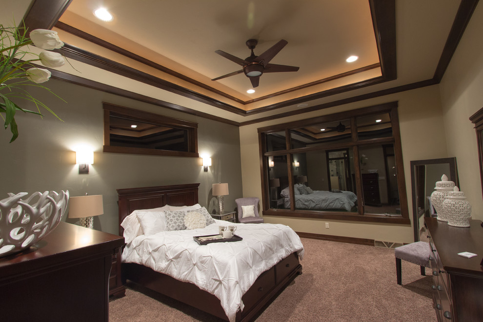 Design ideas for a transitional bedroom in Milwaukee with beige walls and carpet.