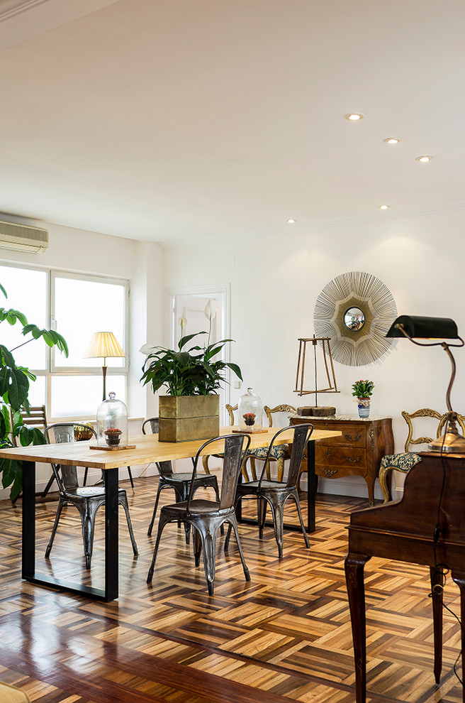 Photo of a mid-sized transitional open plan dining in Madrid with white walls, dark hardwood floors and no fireplace.