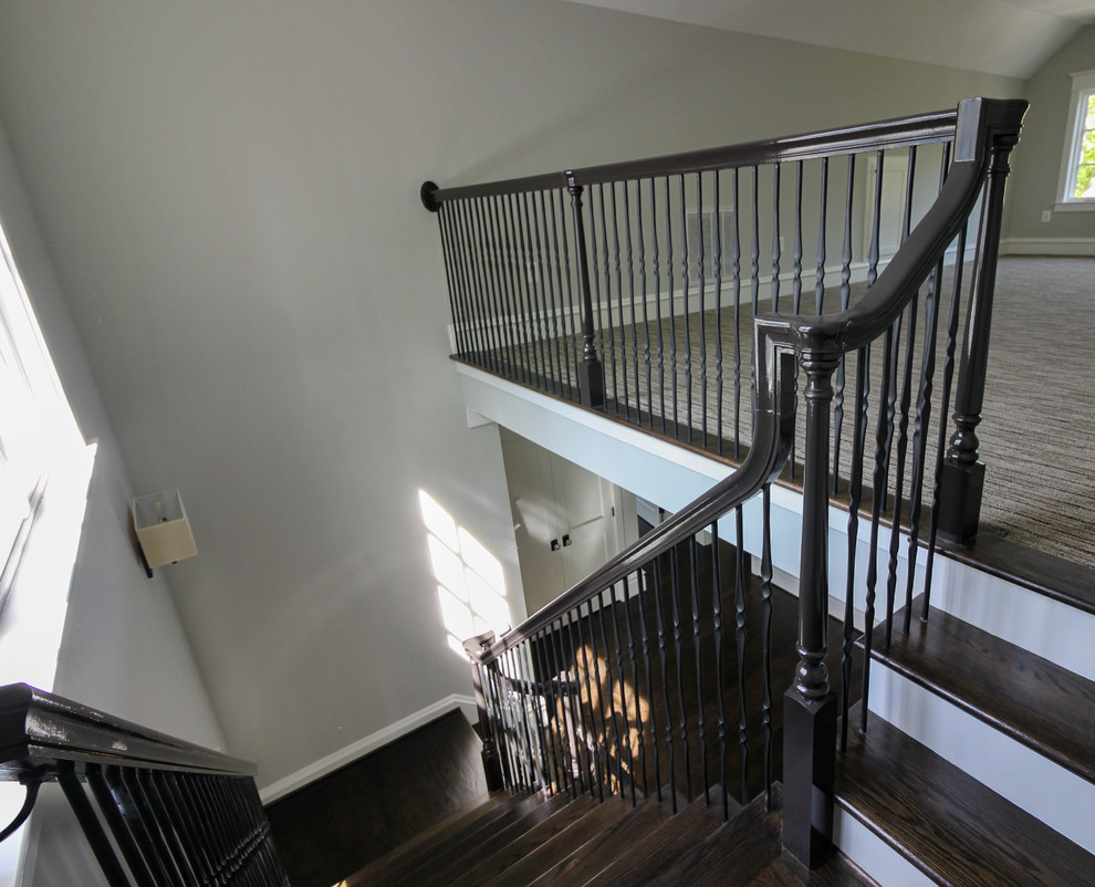 Inspiration for a large transitional wooden l-shaped mixed material railing staircase remodel in DC Metro with painted risers