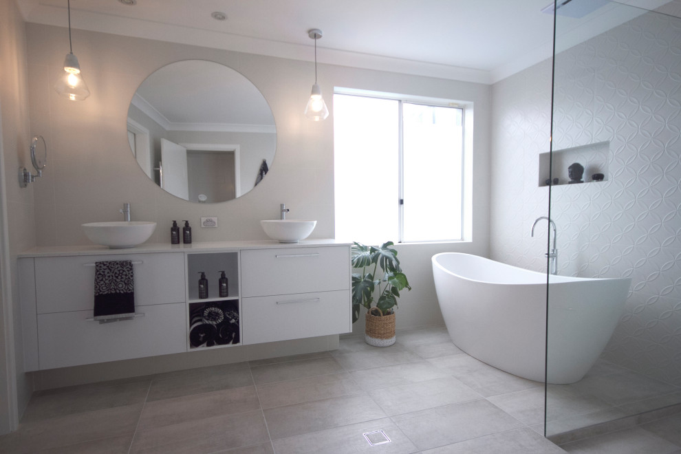 Inspiration for a mid-sized beach style master bathroom in Perth with open cabinets, white cabinets, a freestanding tub, a corner shower, a one-piece toilet, white tile, white walls, a vessel sink, beige floor, an open shower, white benchtops, an enclosed toilet, a double vanity and a built-in vanity.