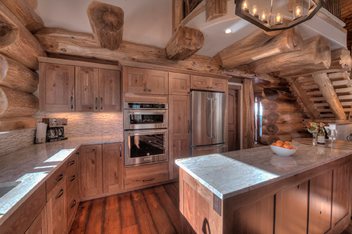 Inspiration for a mid-sized rustic u-shaped medium tone wood floor open concept kitchen remodel in Denver with shaker cabinets, light wood cabinets and an island