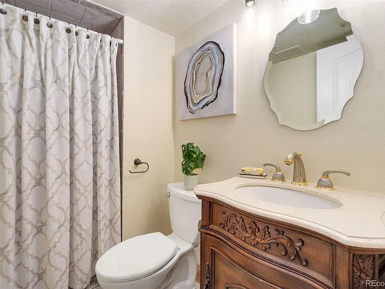 Example of a transitional home design design in Denver