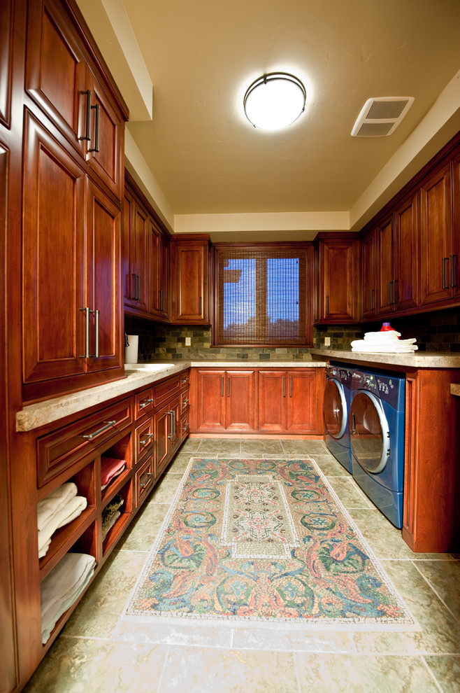 Design ideas for a galley utility room in Sacramento with a drop-in sink, beaded inset cabinets, red cabinets, granite benchtops, multi-coloured walls, travertine floors, a side-by-side washer and dryer, green floor and multi-coloured benchtop.